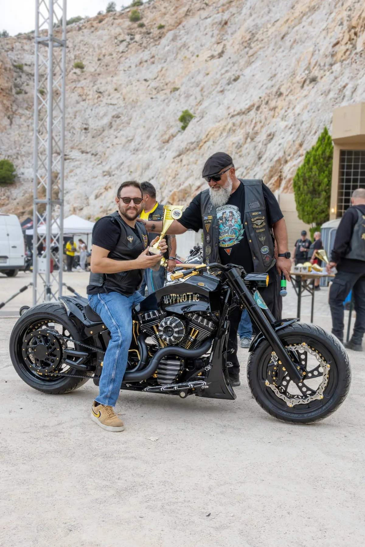 Food truck at the event with a motorcycle parked in front