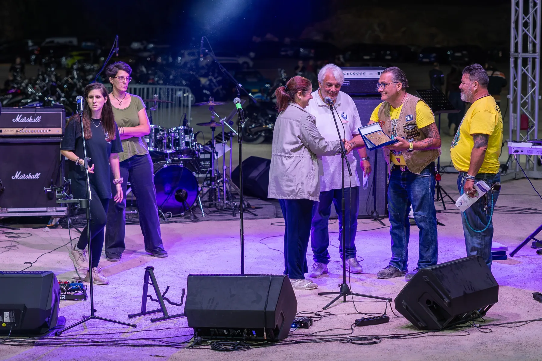 Commemorative plaque being presented on stage during Bike Show 2026